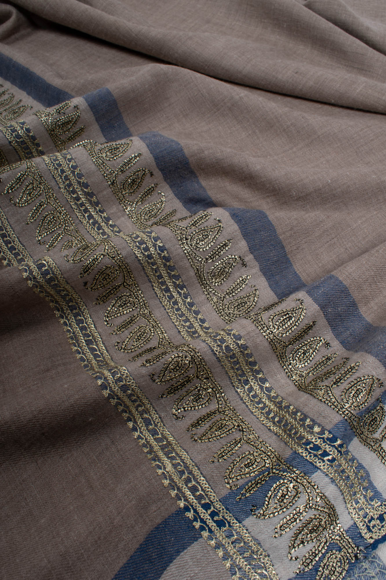 Gray Pashmina Shawl embellished with artistic Water Gold Tilla Embroidery.