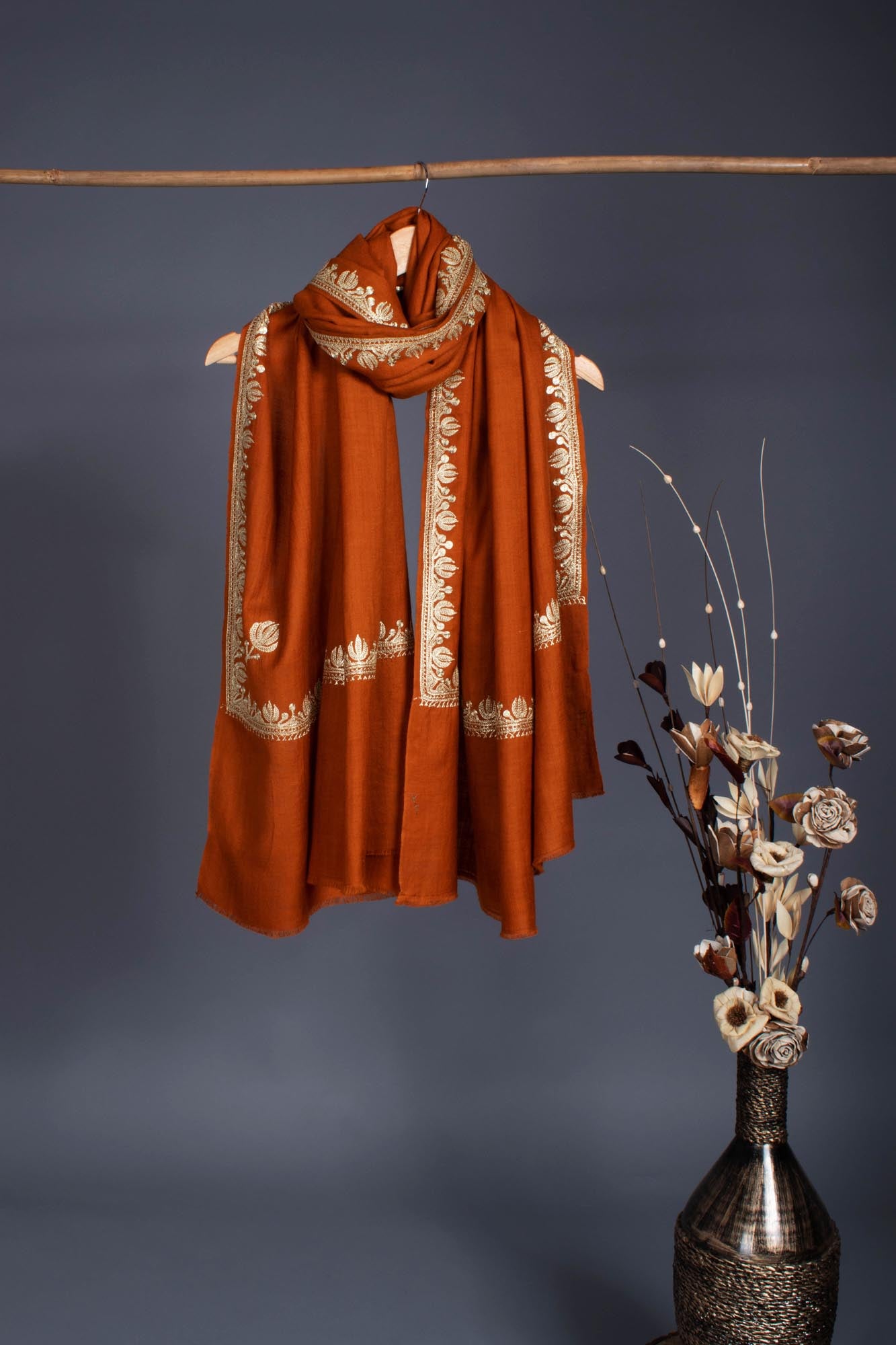 Rust Pashmina Wrap adorned with a Lotus Motif Tilla - BHANDARIA