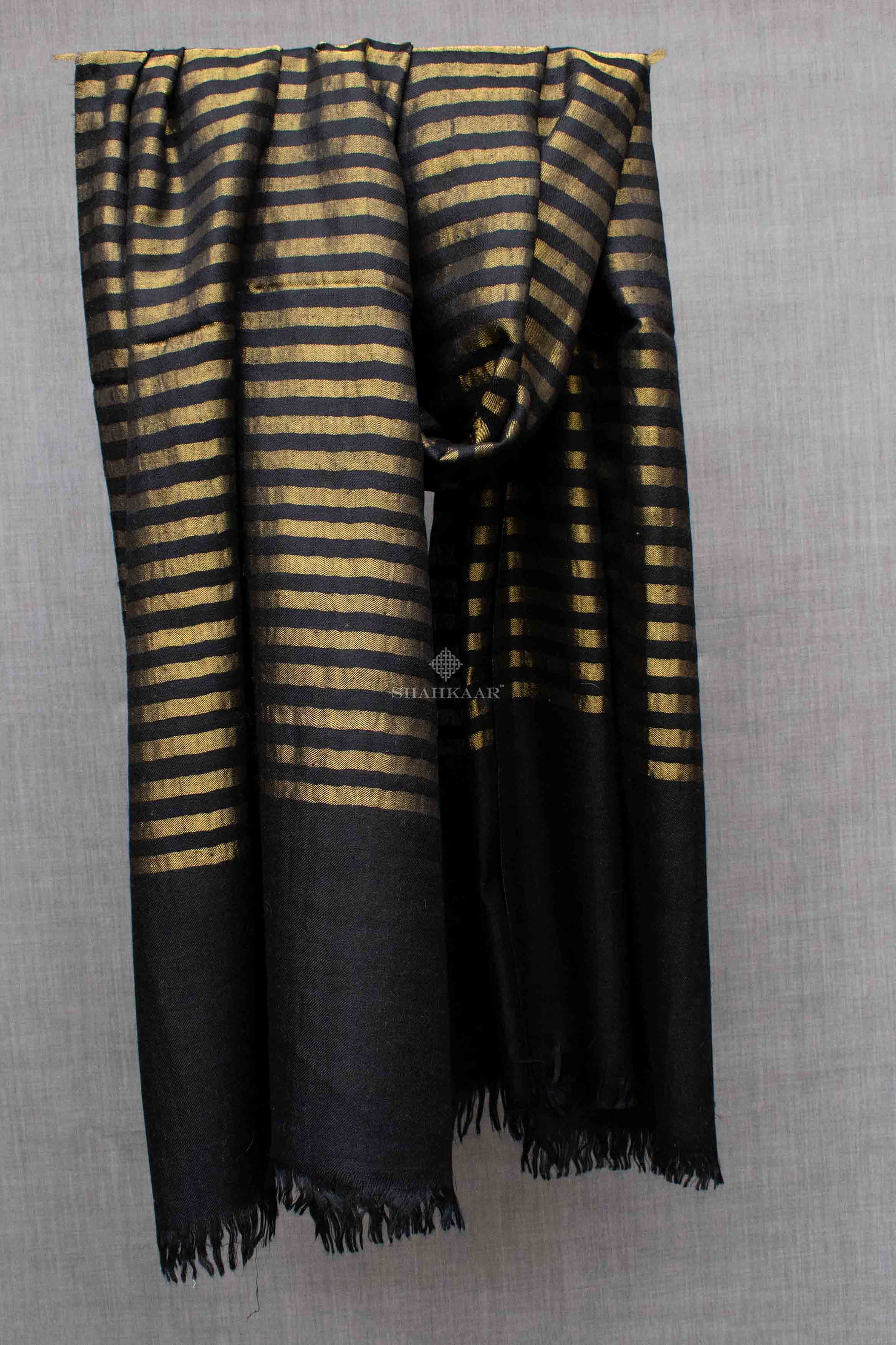 Shahkaar Stripped Black & Golden Cashmere Zari Shawl hanged on a rope