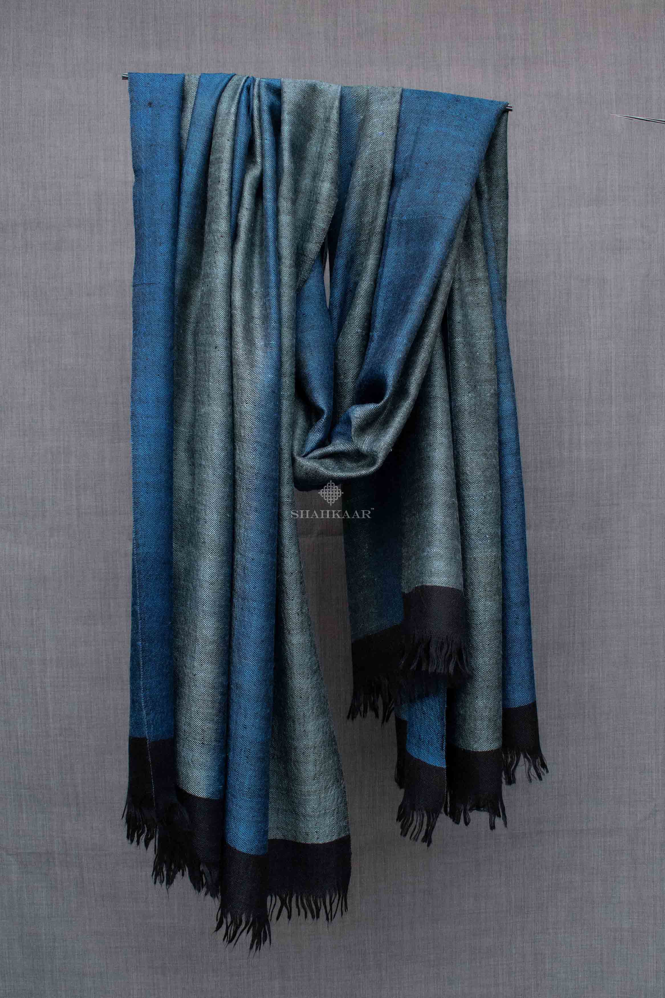 Shahkaar Space Dyed Black & Blue Cashmere Shawl hanged on a rope