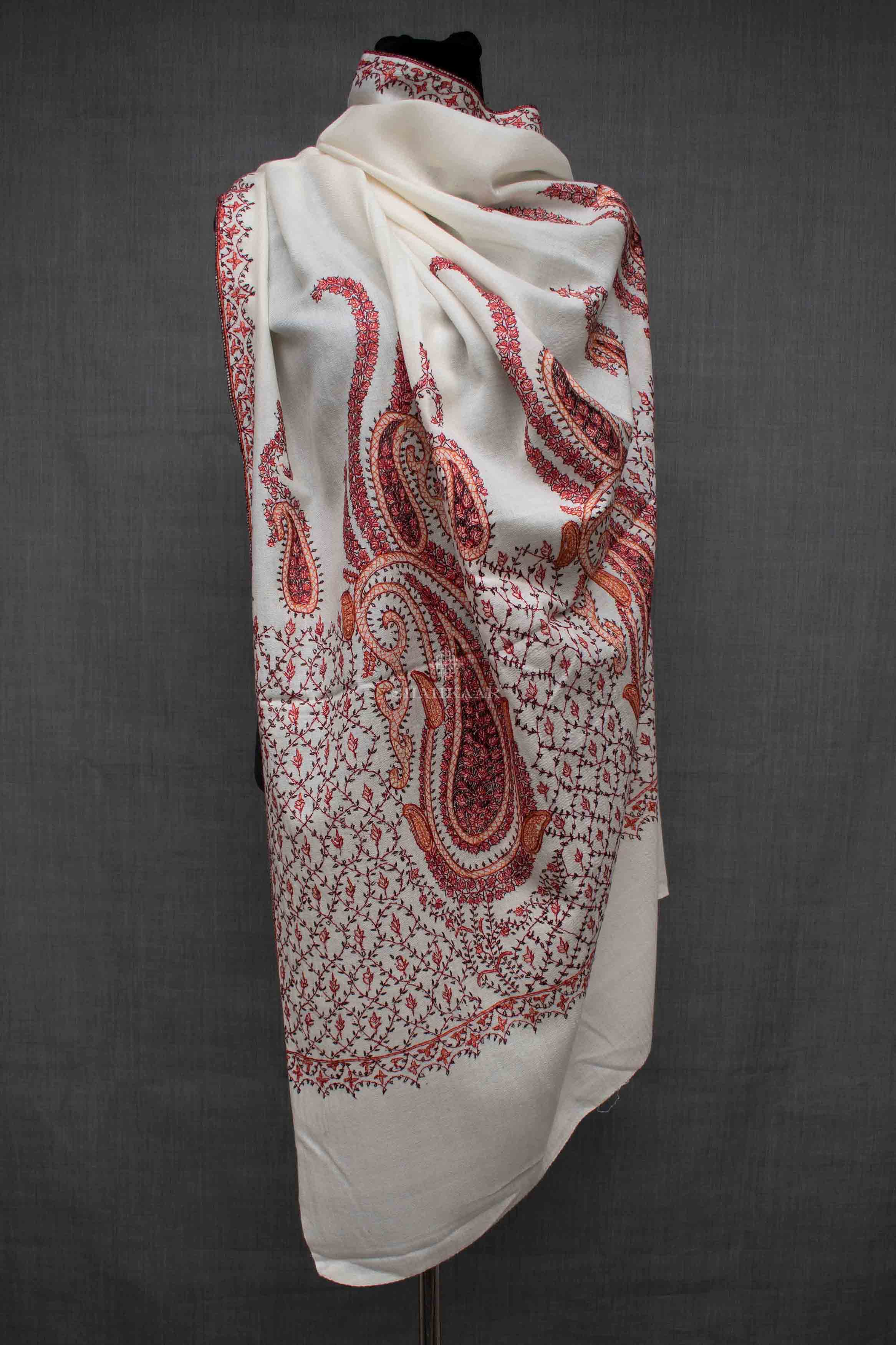 Shahkaar Embroidered White Woollen Shawl wrapped on a dummy